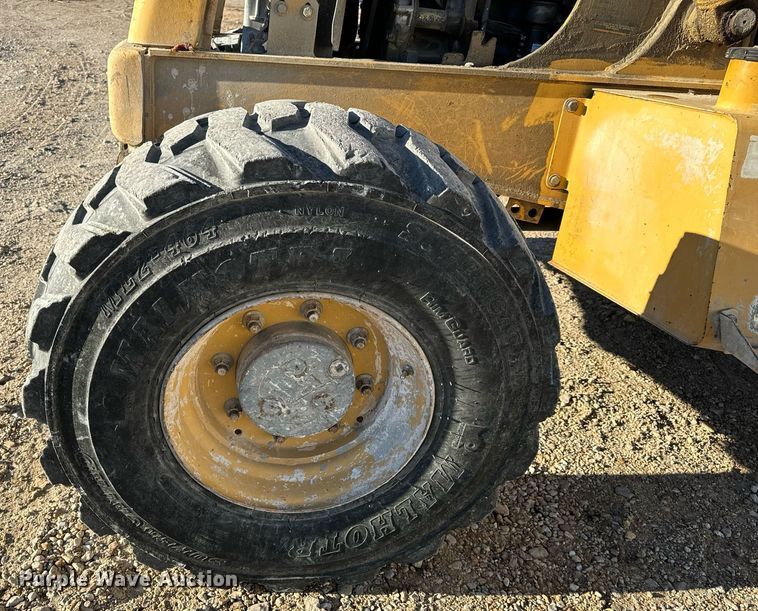 image for item NM9107 1999 New Holland 555E  backhoe