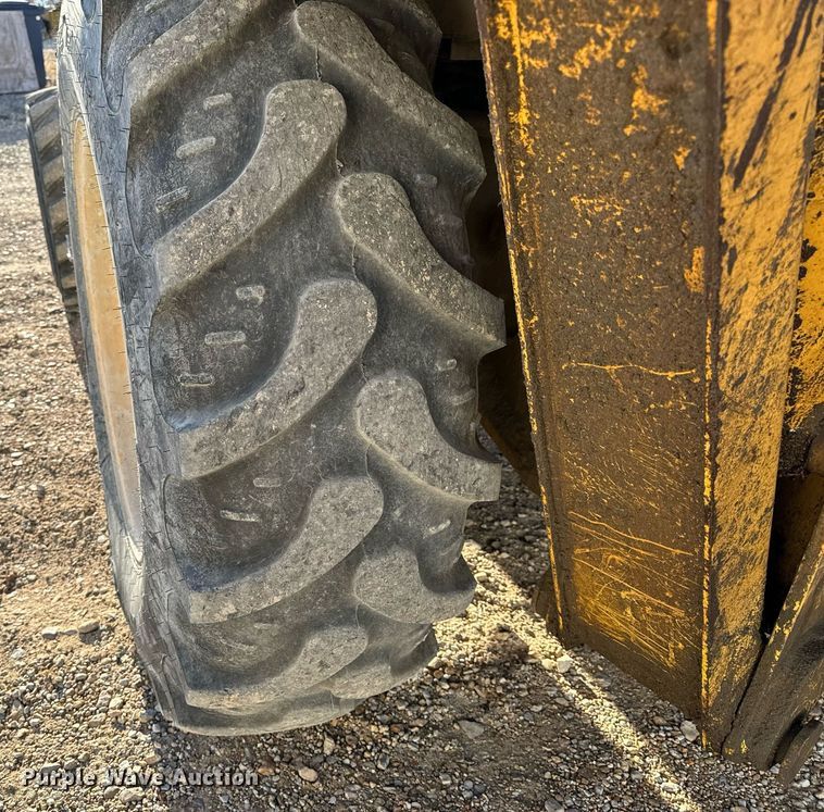 image for item NM9107 1999 New Holland 555E  backhoe