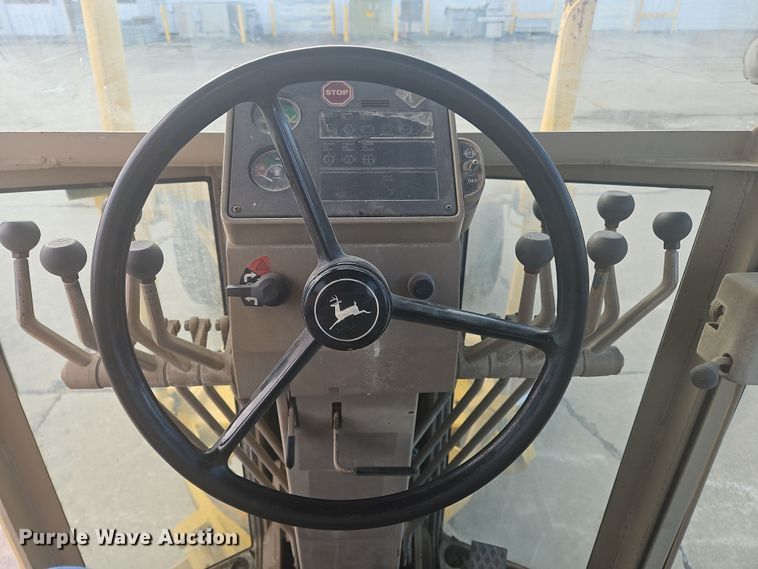 image for item NZ9097 1994 John Deere 570B  motor grader