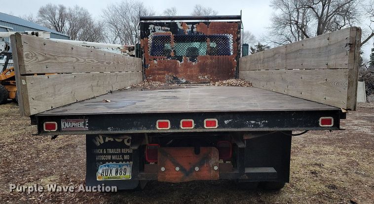 image for item LC9512 2000 International 4700  dump flatbed truck