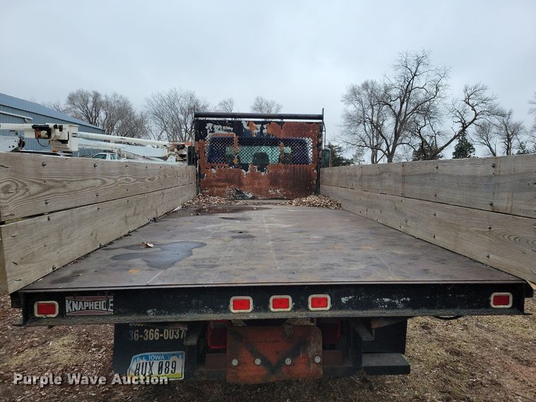 image for item LC9512 2000 International 4700  dump flatbed truck