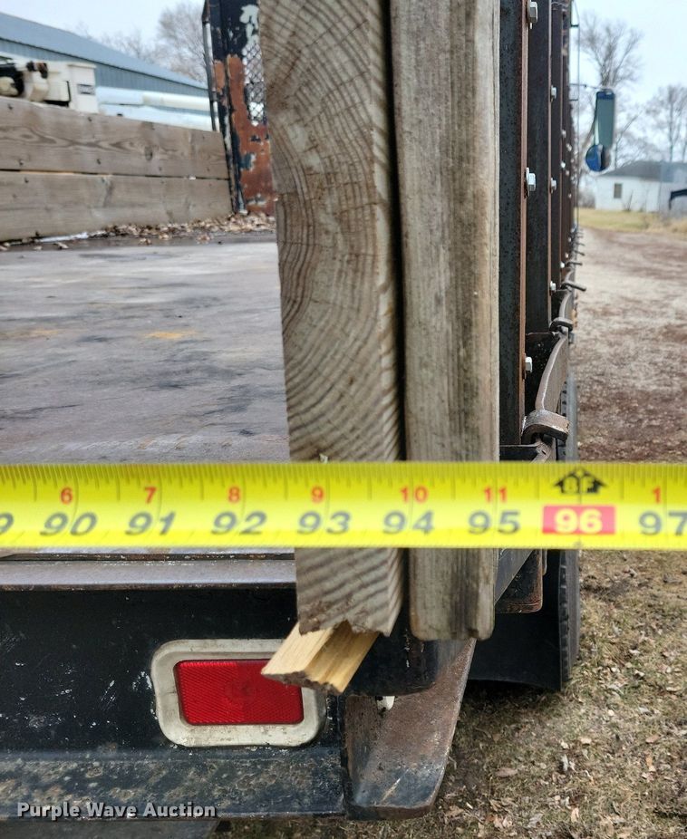 image for item LC9512 2000 International 4700  dump flatbed truck