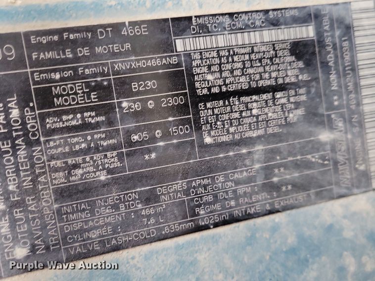 image for item LC9512 2000 International 4700  dump flatbed truck