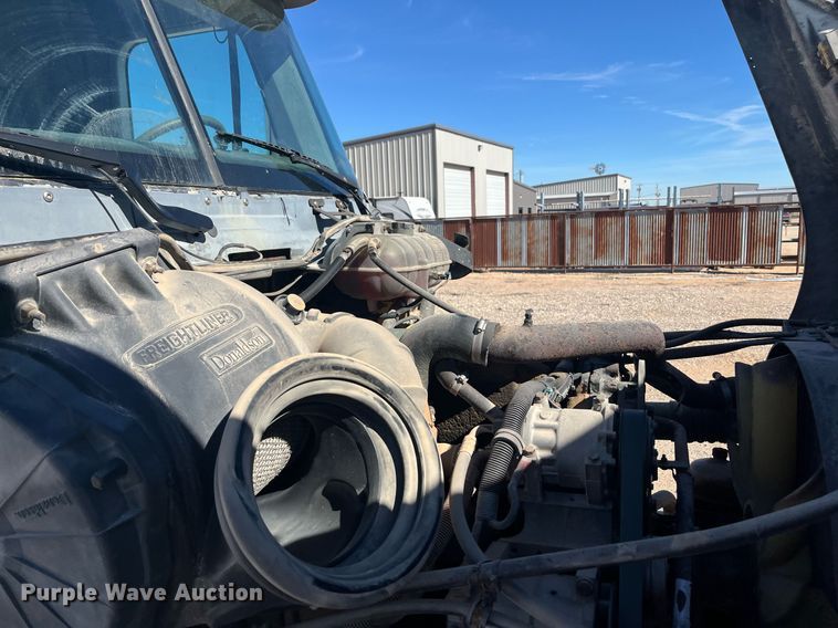 image for item EI0609 2000 Freightliner FLC120 semi truck