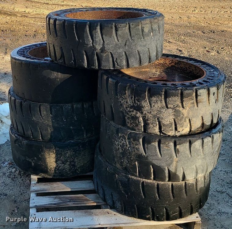 (7) solid skid steer tires and wheels in Odessa, MO Item DN8313 for