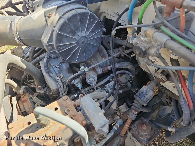 image for item EJ6023 2000 GMC C7500 flatbed truck