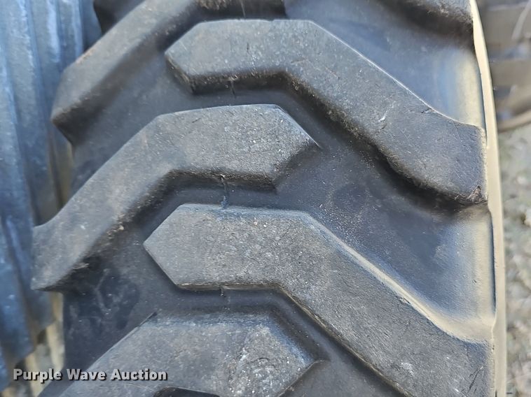 image for item NE9540 (4) used Titan tractor tires and wheels