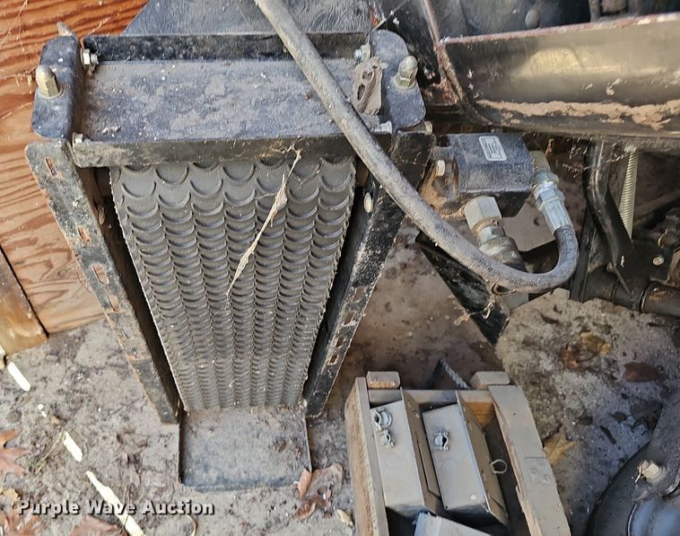 image for item NE9546 2005 Ryan Cushman Core Harvester attachment