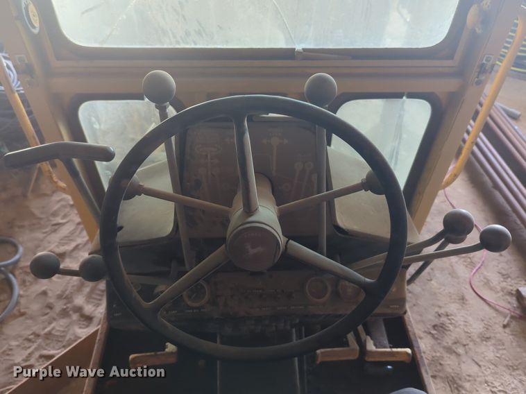 image for item NZ9378 John Deere  570 motor grader