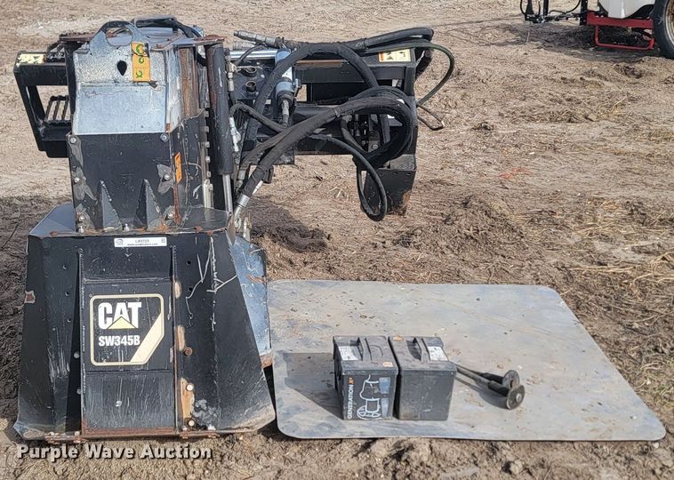 image for item LA9729 2015 Caterpillar SW345B skid steer rock saw