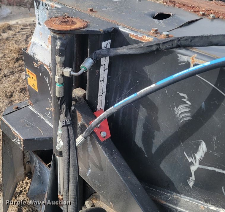 image for item LA9729 2015 Caterpillar SW345B skid steer rock saw