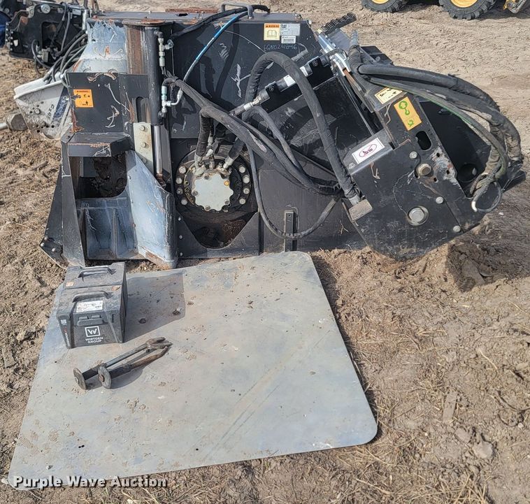 image for item LA9729 2015 Caterpillar SW345B skid steer rock saw