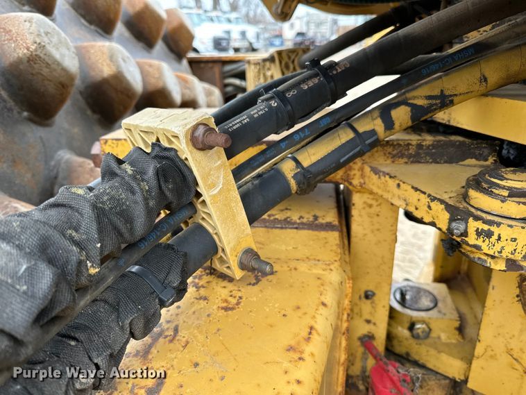 image for item DQ0599 1999 Caterpillar  CP-563C single drum vibratory roller