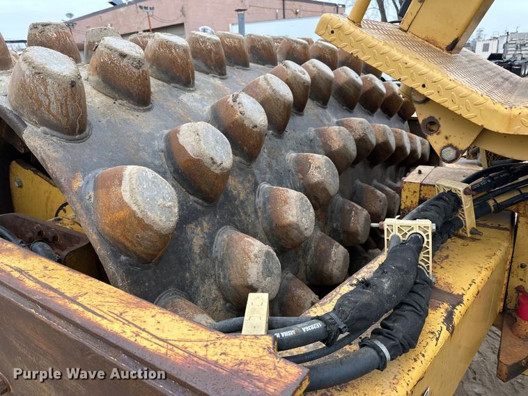 image for item DQ0599 1999 Caterpillar  CP-563C single drum vibratory roller