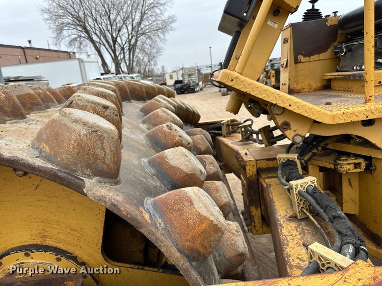 image for item DQ0599 1999 Caterpillar  CP-563C single drum vibratory roller