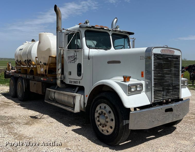 image for item DS2934 1989 Freightliner FLC flatbed truck with Vermeer fluid mixer