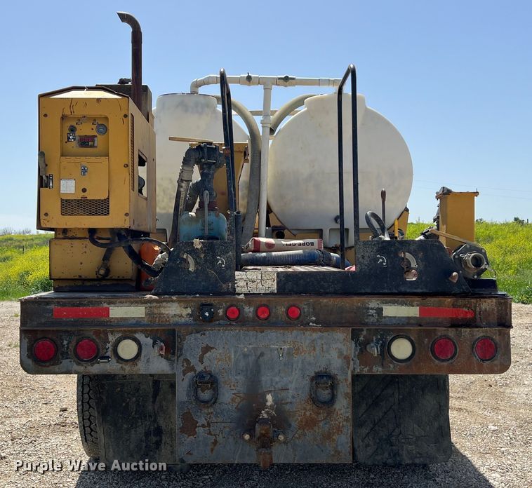 image for item DS2934 1989 Freightliner FLC flatbed truck with Vermeer fluid mixer