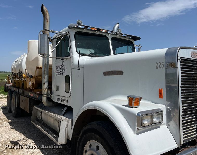 image for item DS2934 1989 Freightliner FLC flatbed truck with Vermeer fluid mixer