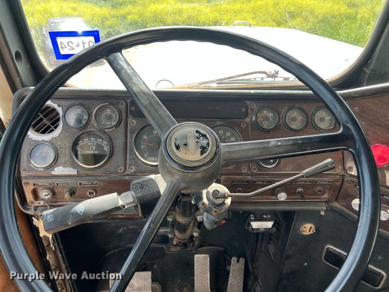 image for item DS2934 1989 Freightliner FLC flatbed truck with Vermeer fluid mixer