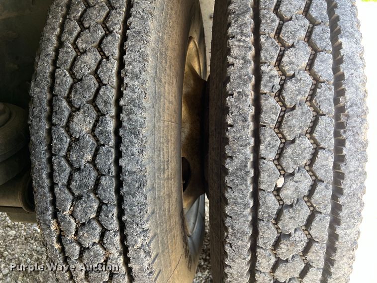 image for item DS2934 1989 Freightliner FLC flatbed truck with Vermeer fluid mixer