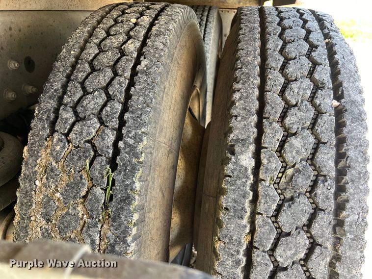 image for item DS2934 1989 Freightliner FLC flatbed truck with Vermeer fluid mixer