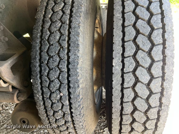 image for item DS2934 1989 Freightliner FLC flatbed truck with Vermeer fluid mixer