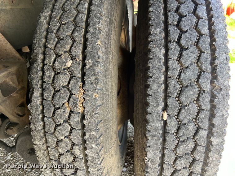 image for item DS2934 1989 Freightliner FLC flatbed truck with Vermeer fluid mixer