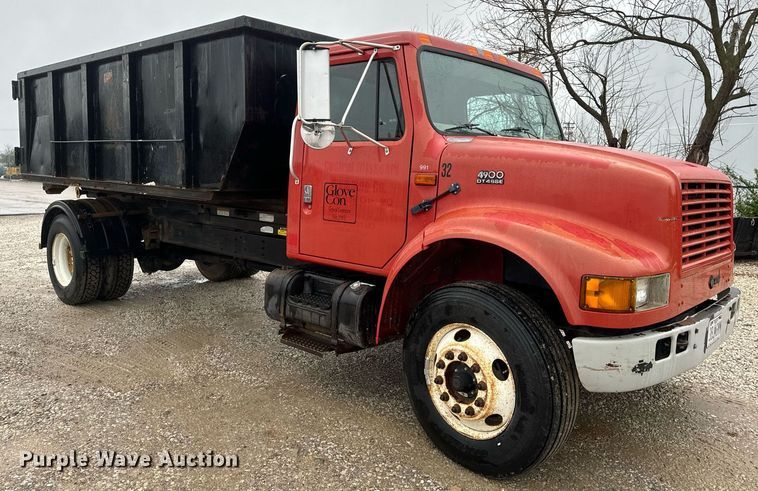 image for item EH6641 1999 International 4900 roll-off container truck