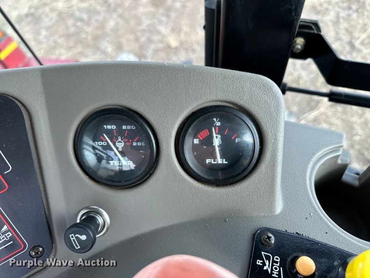 image for item OI9301 2016 MacDon M205 swather / windrower