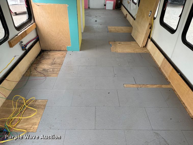 image for item EJ0393 2002 International  3400 shuttle bus