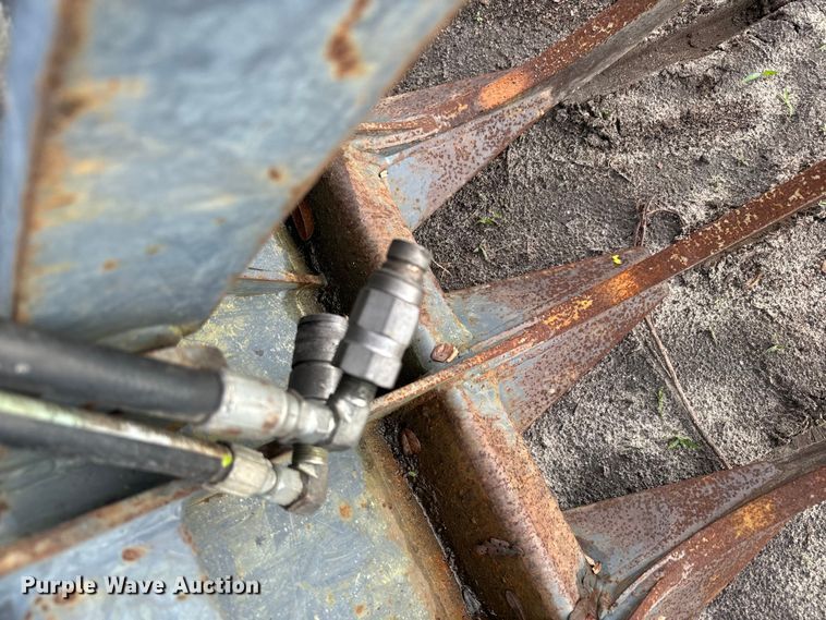 image for item EH5411 Rake Shop skid steer grapple bucket