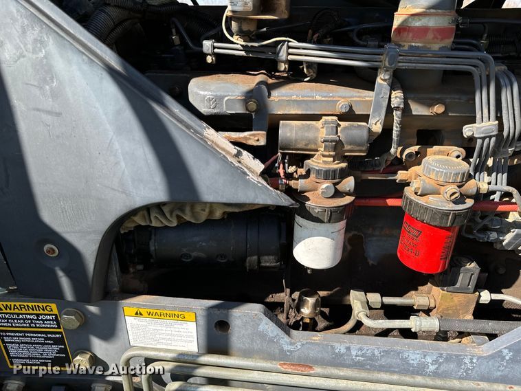 image for item ND9219 1999 New Holland TV140 bi-directional tractor