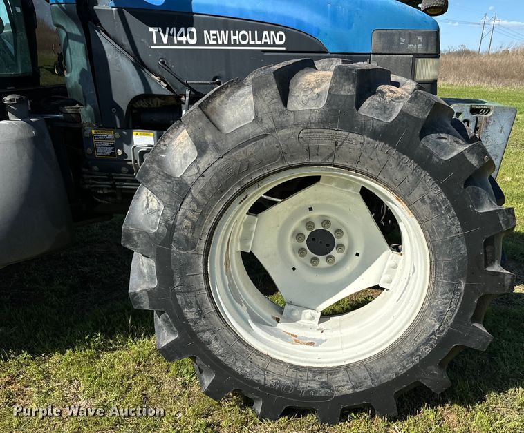 image for item ND9219 1999 New Holland TV140 bi-directional tractor