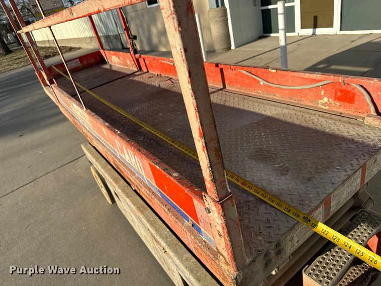 image for item NH9011 1997 SkyJack SJ3220 scissor lift