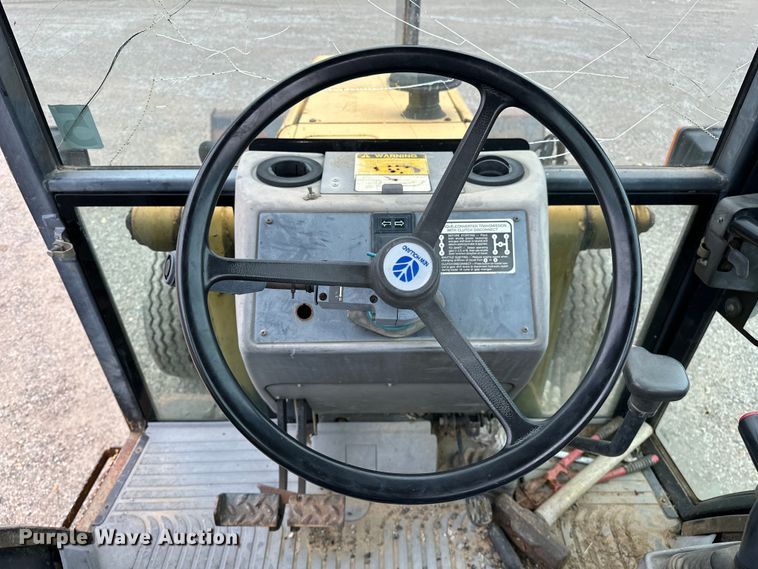 image for item NR9878 New Holland  575D backhoe