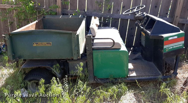 image for item NH9212 (2) Cushman golf carts