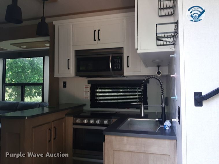 image for item DQ7055 2022 Keystone Raptor toy hauler camper