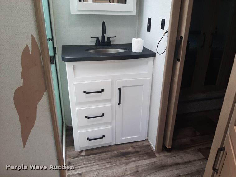 image for item DQ7055 2022 Keystone Raptor toy hauler camper