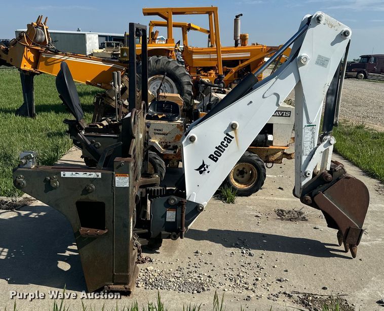 image for item EJ2704 Bobcat 709 Backhoe skid steer backhoe