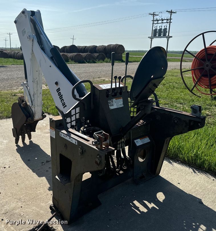 image for item EJ2704 Bobcat 709 Backhoe skid steer backhoe