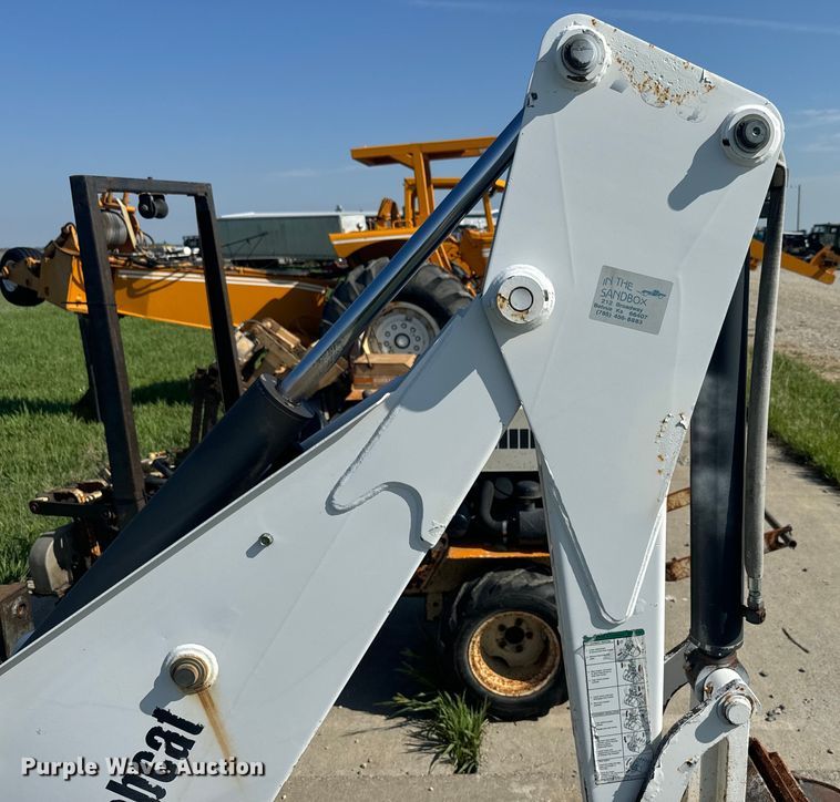 image for item EJ2704 Bobcat 709 Backhoe skid steer backhoe
