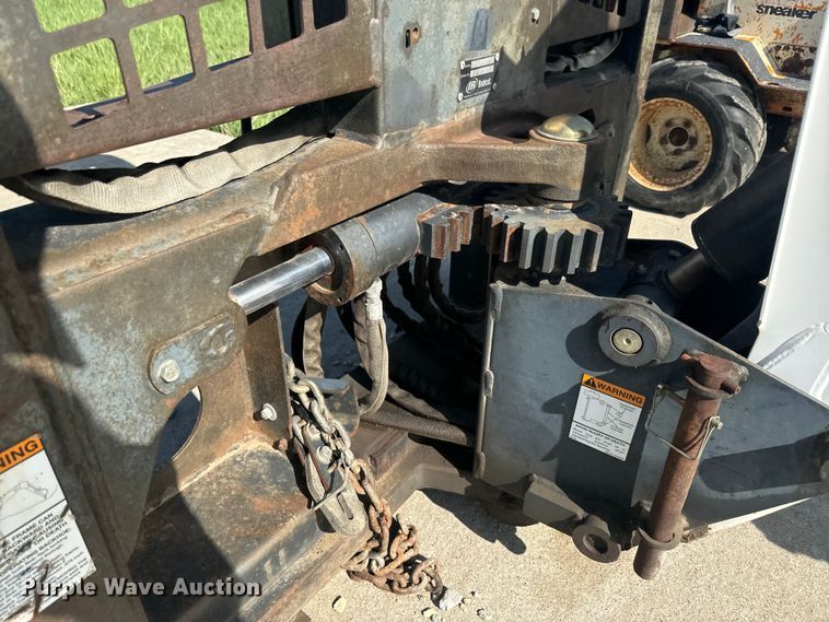 image for item EJ2704 Bobcat 709 Backhoe skid steer backhoe