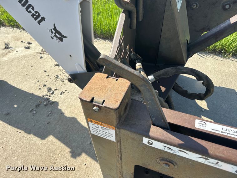 image for item EJ2704 Bobcat 709 Backhoe skid steer backhoe