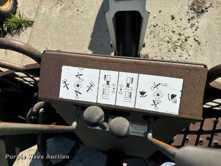 image for item EJ2704 Bobcat 709 Backhoe skid steer backhoe