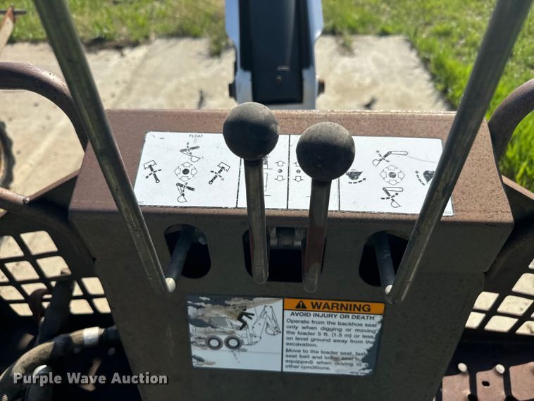 image for item EJ2704 Bobcat 709 Backhoe skid steer backhoe