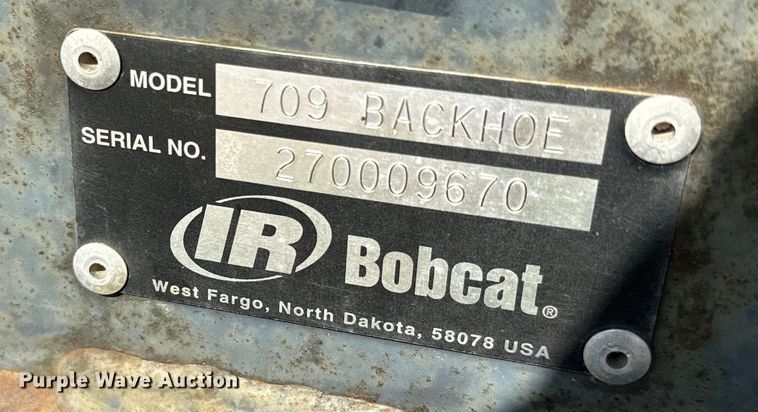 image for item EJ2704 Bobcat 709 Backhoe skid steer backhoe