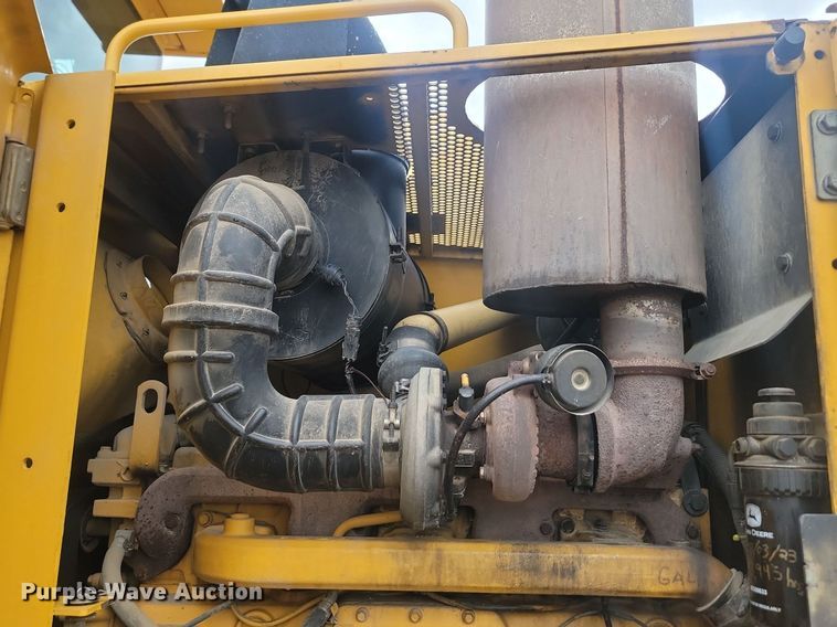 image for item NZ9852 1999 John Deere 772CH motor grader