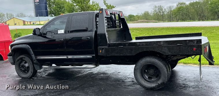image for item DQ0834 2005 Dodge  Ram 3500 Quad Cab flatbed pickup truck