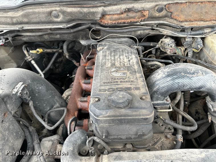 image for item DQ0834 2005 Dodge  Ram 3500 Quad Cab flatbed pickup truck