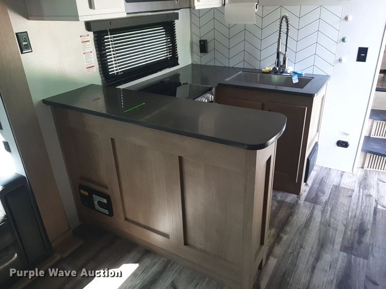 image for item DQ7055 2022 Keystone Raptor toy hauler camper